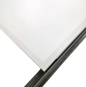 Close-up of a white rectangular panel with a black border on a white background