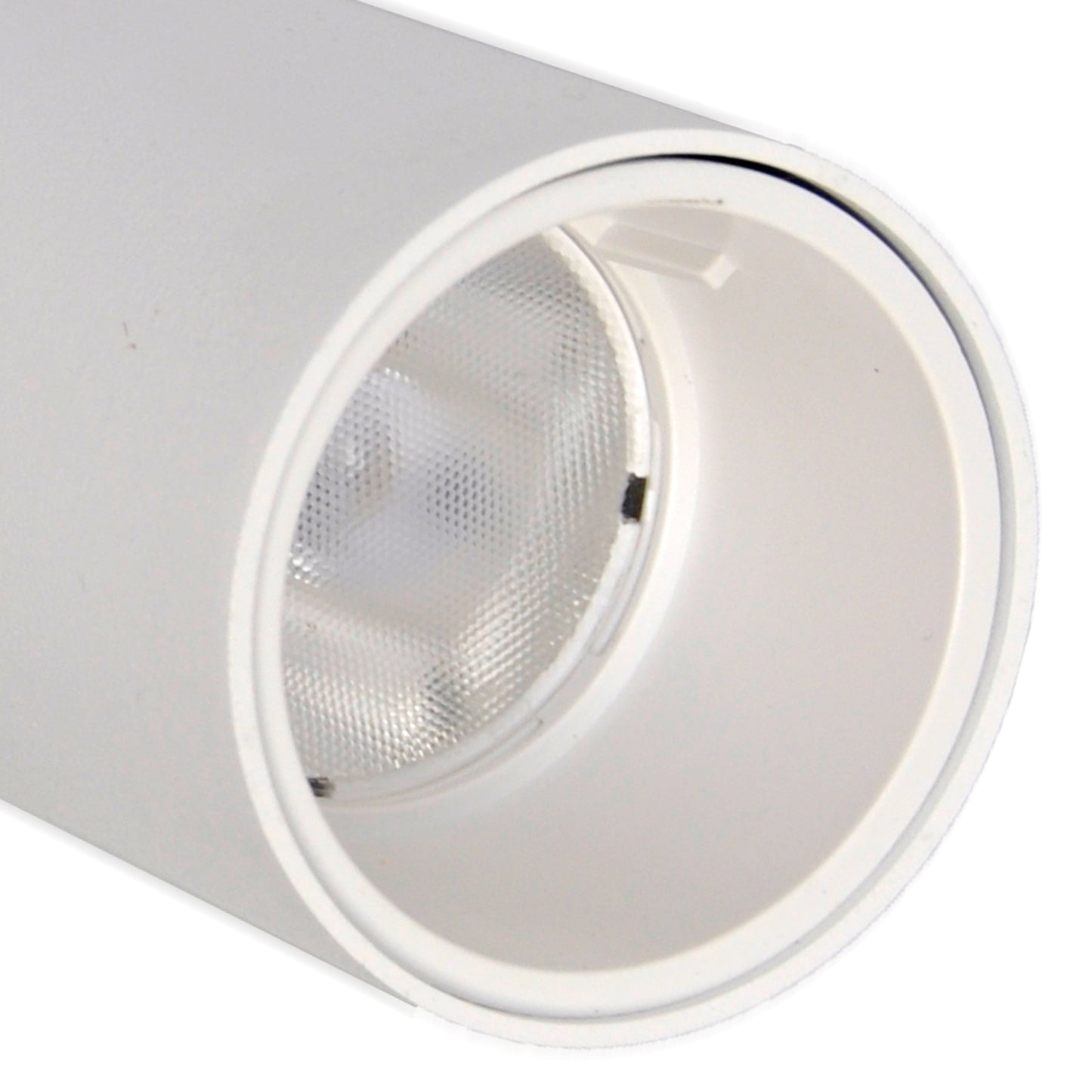 Close-up of a white recessed ceiling light on a white background