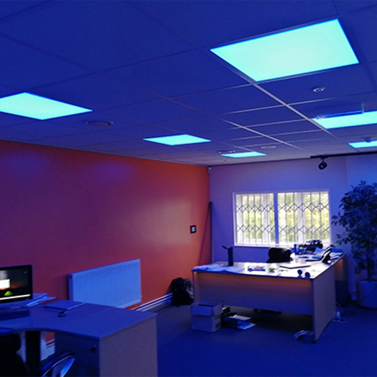 Modern office interior with blue fluorescent lights on a ceiling