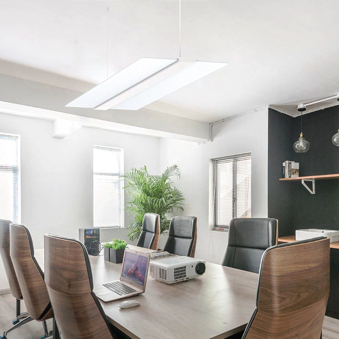 Modern conference room with suspended LED lighting.